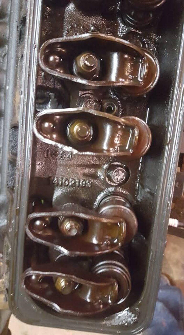 A close view of exposed rocker arms and valve springs.